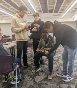 Students working together to build a robot